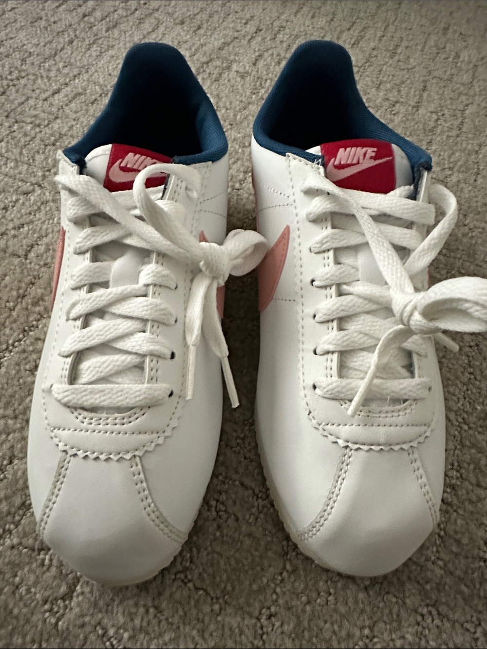 Nike Cortez - White Sneakers with Pink Swoosh, Navy Lining. Size 7W